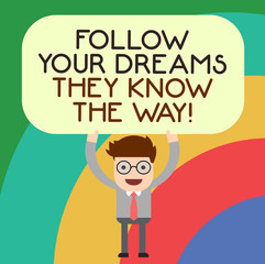 Handwriting text writing Follow Your Dreams They Know The Way. Concept meaning Inspiration motivation to get success Man Standing Holding Above his Head Blank Rectangular Colored Board