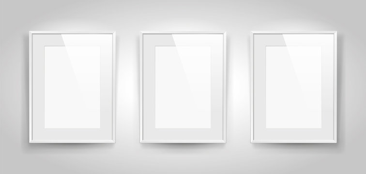 Three realistic empty rectangular white frames with passepartout on gray background, border for your creative project, mock-up sample, picture on the wall, vector design object