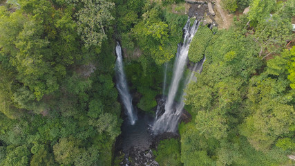 waterfall in green rainforest. Aerial view triple tropical waterfall Sekumpul in mountain jungle. Bali,Indonesia. Travel concept.