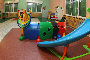 wide hall of a kindergarten with many toys