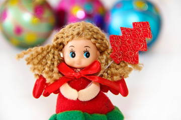 New Year's little doll fairy in a festive Christmas red dress