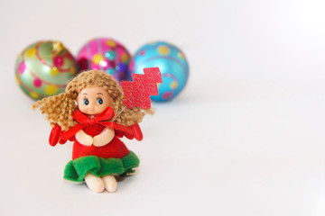 New Year's little doll fairy in a festive Christmas red dress