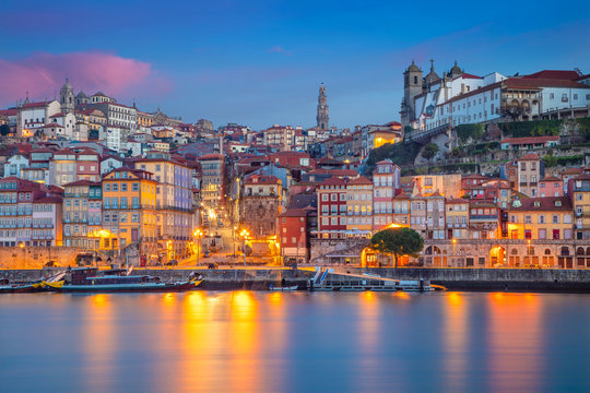 Porto, Portugal. Cityscape image of Porto, Portugal with reflection of the city in the Douro River during sunrise.