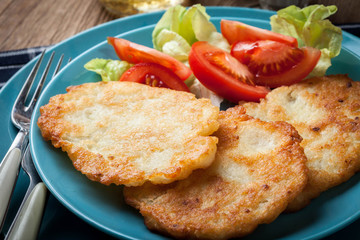 Crispy fried homemade potato pancakes.