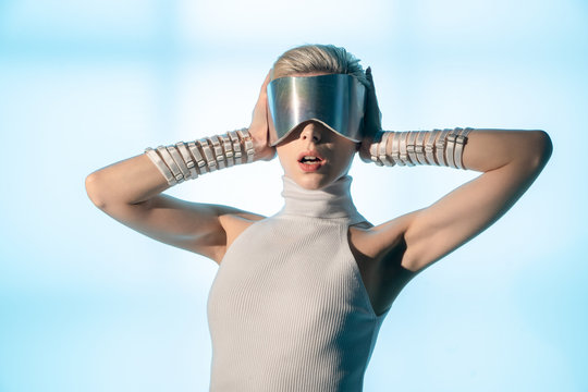 Blonde girl wearing virtual reality glasses