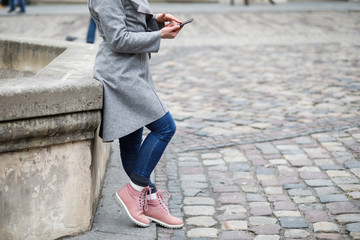 Beautiful girl using smart phone in the city.