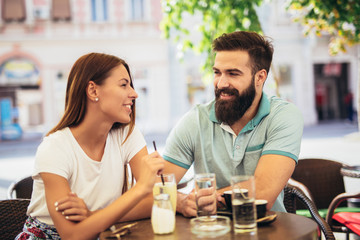 Beautiful couple having coffee on a date
