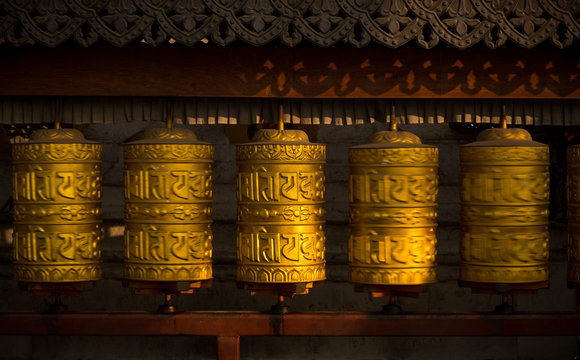 Rotating Buddhist Prayer Wheels As Symbol Of Buddhism Religion