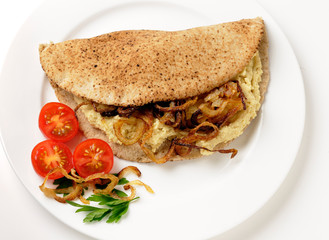 Hummus and fried onion pita sandwich