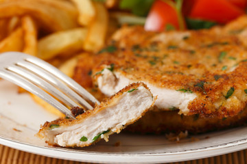 Chicken schnitzel sliced closeup