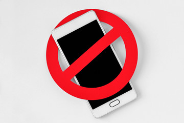 Mobile phone with prohibition sign on white background - No mobile phone concept