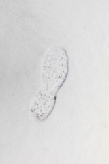 Footprint in snow background texture in winter