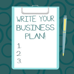 Writing note showing Write Your Business Plan. Business photo showcasing Establish steps to accomplish company goals Sheet of Bond Paper on Clipboard with Ballpoint Pen Text Space