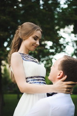 Fototapeta premium Romantic wedding moment, couple of newlyweds smiling portrait, bride and groom hug.