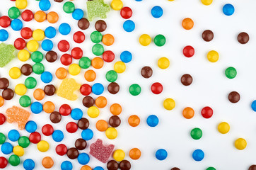 Abstract pattern with round color candy on background. Colorful sweets top view. Flat lay image