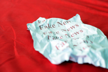 Fake news paper againts chroma key or red background