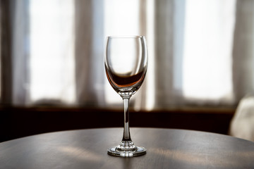 Empty Wine glasses with blur curtain background