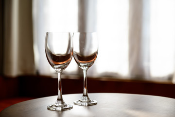 Empty Wine glasses with blur curtain background