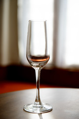 Empty champagne glasses with blur curtain background