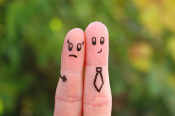 Fingers art of couple. Concept of man harassing woman at work.