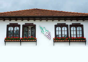 a beautiful country house with flowers under the windows in Bulgaria