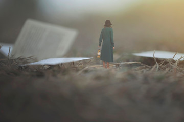 surreal moment of a woman with lantern walking confused in the fog between pages and books