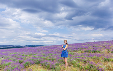 Beautiful girl on the lavender field