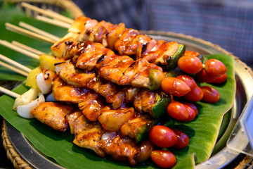 Grilled pork with BBQ sauce on sticks, thailand street food