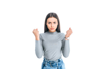 portrait of upset woman showing fists isolated on white