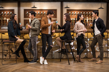 Happy young couple dating in bar