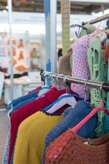 knitted sweaters on the rack