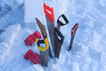 Tools for building a snow dwelling called an igloo.