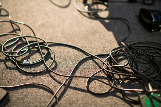 Black cables on stage carpet floor foto de Stock | Adobe Stock