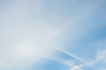 Fototapeta na wymiar blue sky with white soft clouds, blurry image.