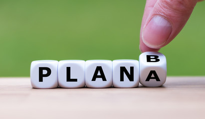 Time for Plan B. Hand is turning a dice and changes the word 