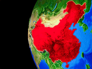 China from space on realistic model of planet Earth with country borders and detailed planet surface.