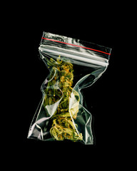 Bags of marijuana on a black background.