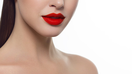 Closeup of beautiful female mouth with red lip makeup.