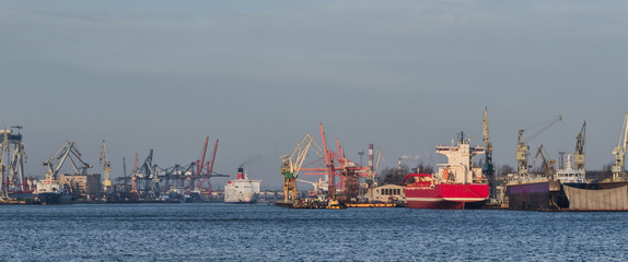 Fototapeta premium SEAPORT - Cargo ships and Passenger Ferry in Gdynia