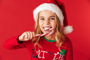 Cheerful little girl wearing Christmas costume