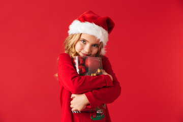 Cheerful little girl wearing Christmas costume
