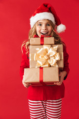 Cheerful little girl wearing Christmas costume