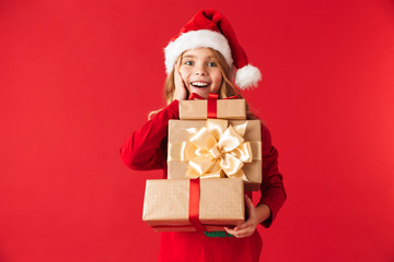 Cheerful little girl wearing Christmas costume