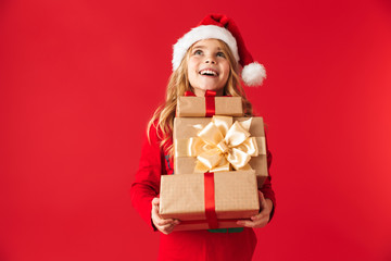 Cheerful little girl wearing Christmas costume