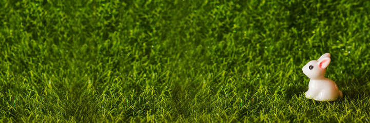figure of rabbit on the grass. Banner blank