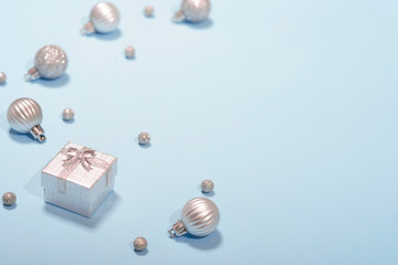 Christmas frame on a blue pink background greeting card gifts decorations silver decor shiny ball Christmas spruce