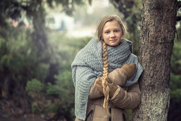 Girl with a scarf in the forest