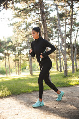 Beautiful fit sportswoman doing warming up exercises