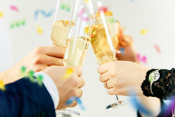 Celebration. Hands holding the glasses of champagne and wine making a toast. The party, celebration, alcohol, lifestyle, friendship, holiday, christmas, new, year and clinking concept