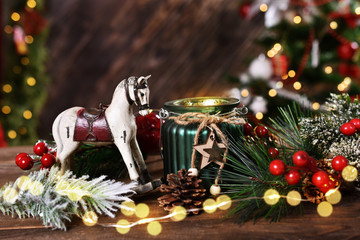 christmas decoration with rocking horse and candle lantern